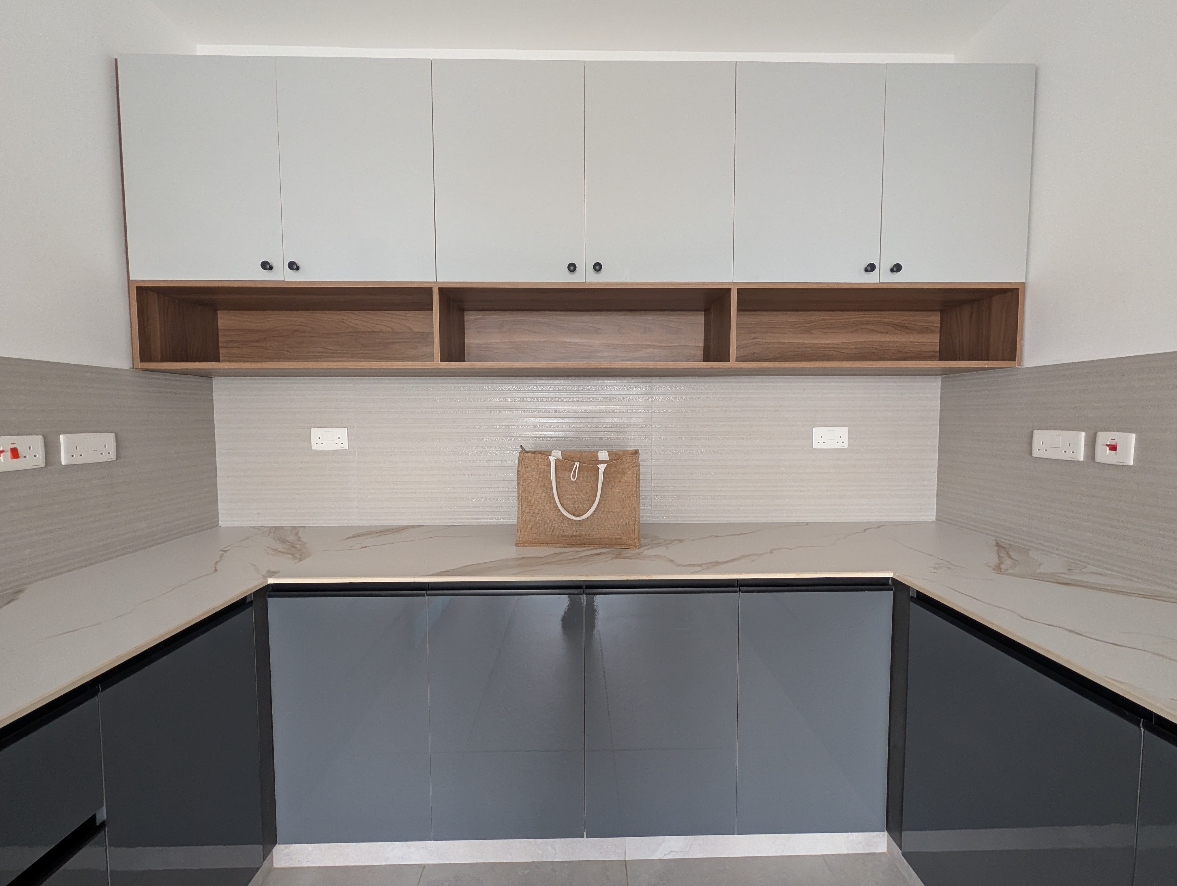 Kitchen cabinetry with wood accent shelving