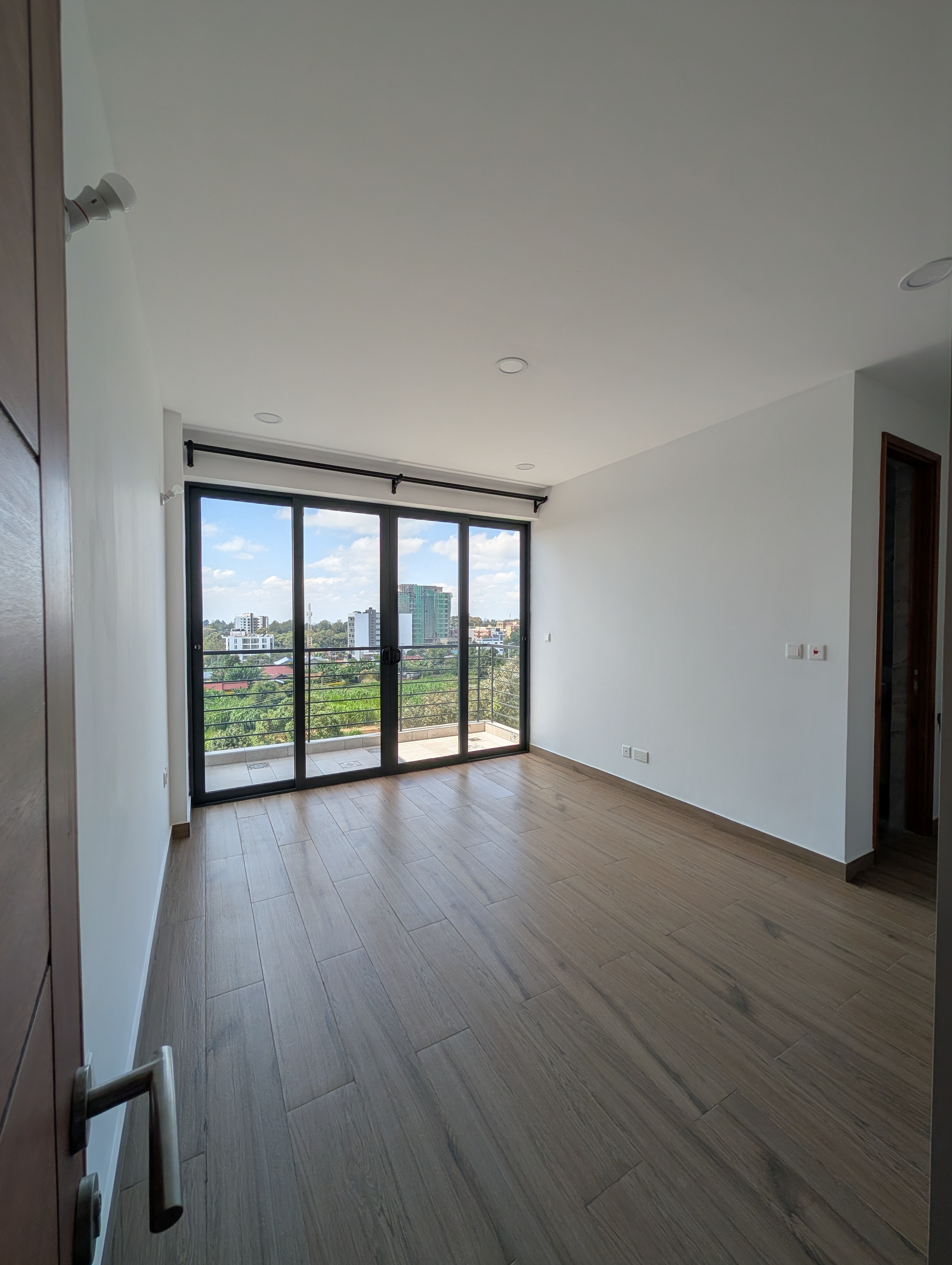 Second bedroom with sliding glass doors to balcony