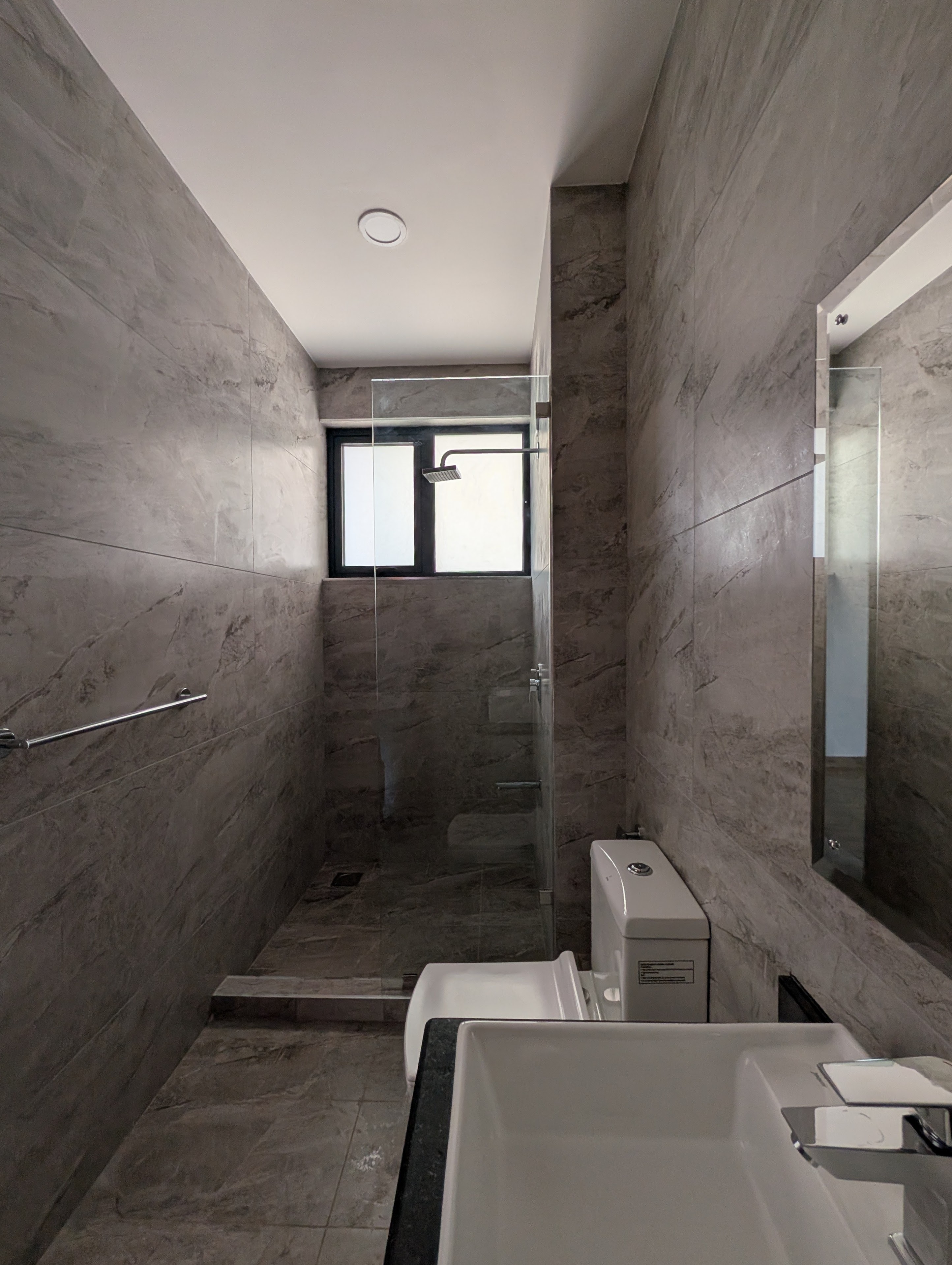 Third bathroom with marble, vessel sink, and rain shower