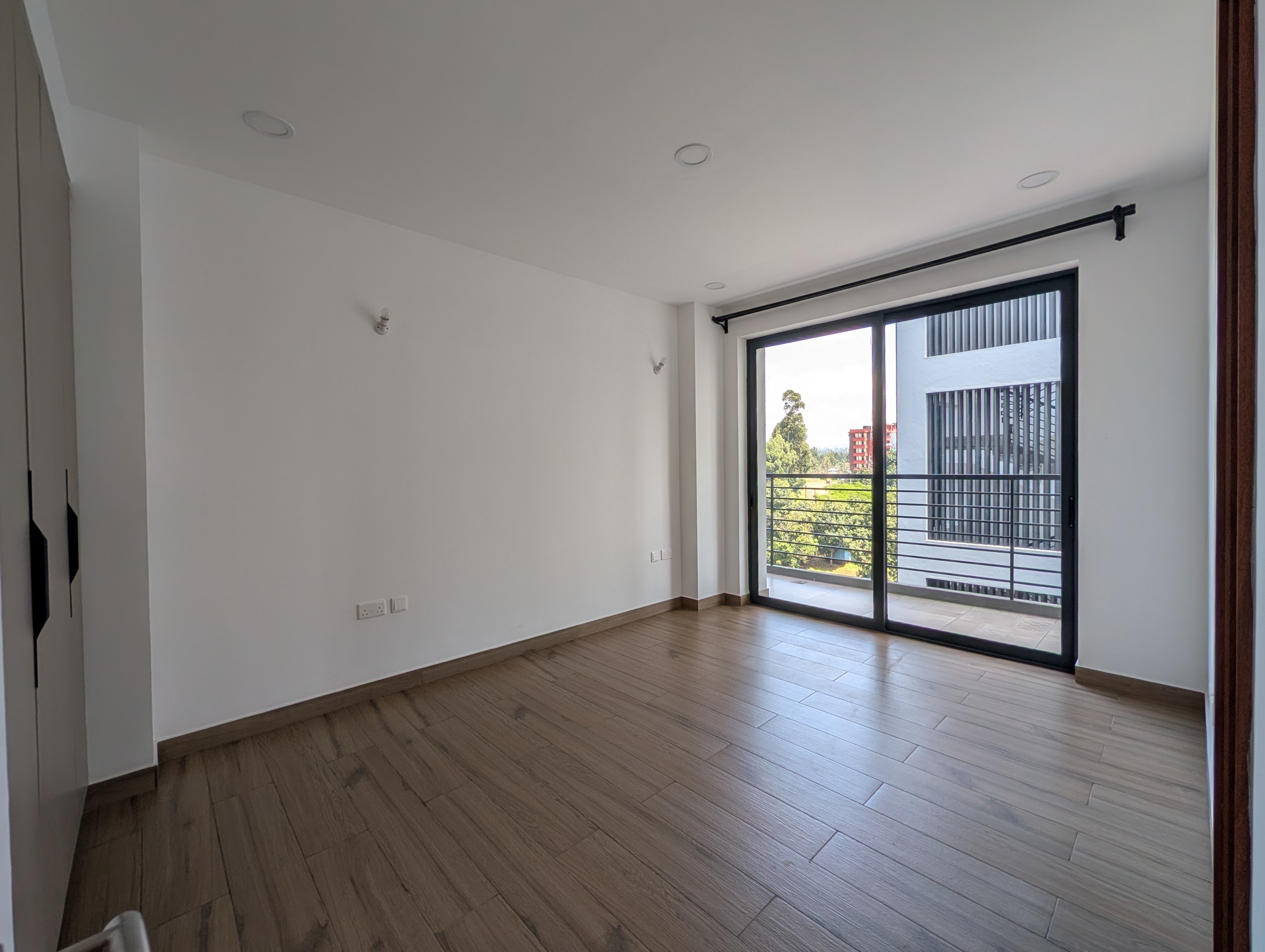 Third bedroom with balcony access and view