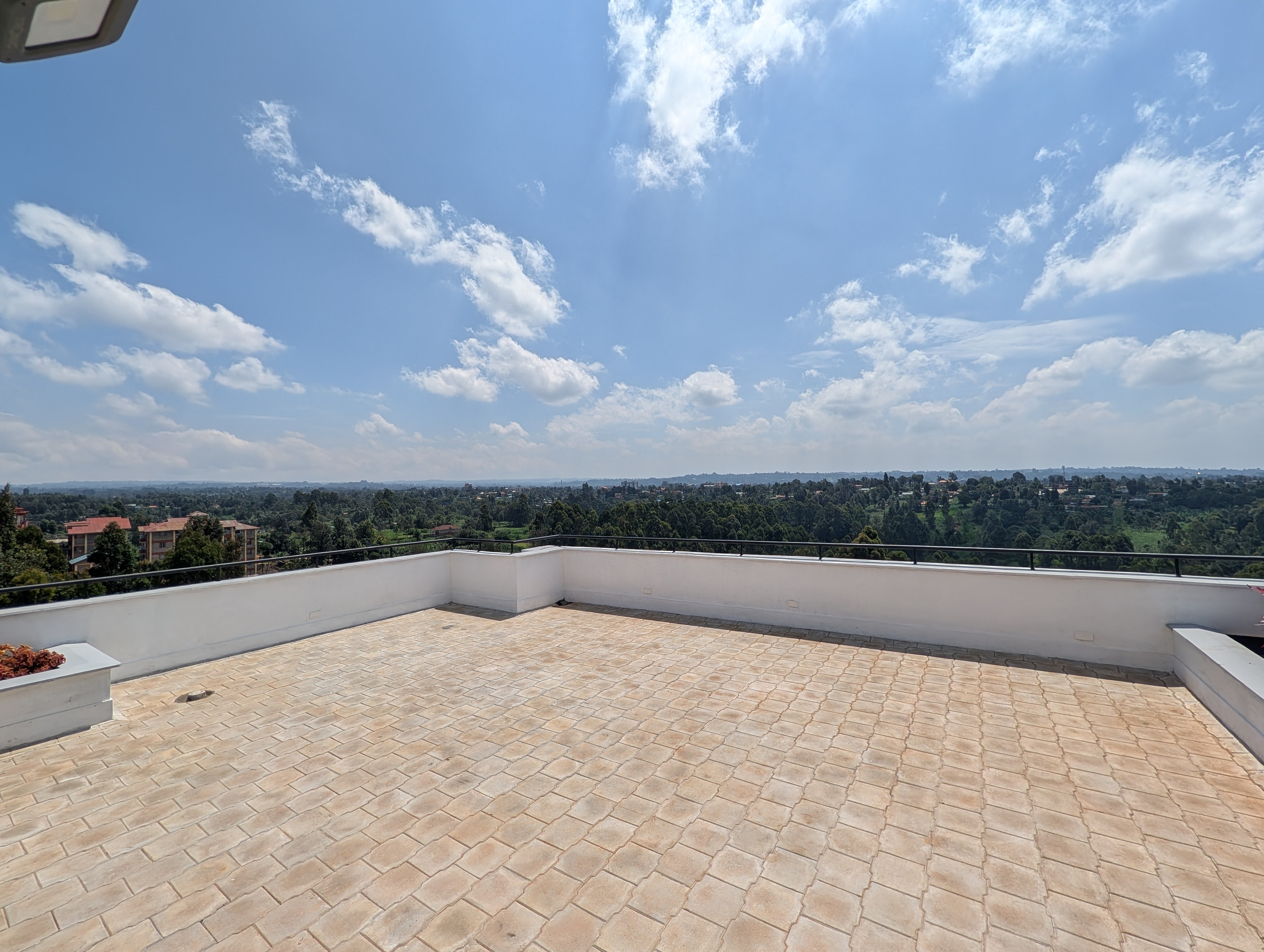 Expansive rooftop terrace with panoramic highland views